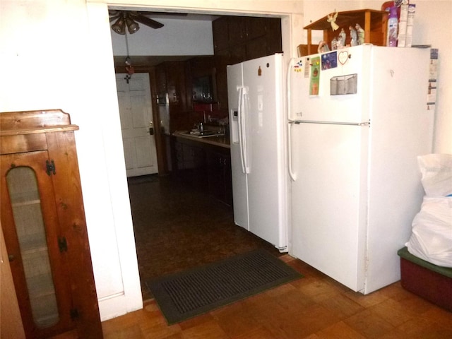302 S Palm Ave, Frostproof, FL 33843 - kitchen with freestanding refrigerator, white fridge with ice dispenser, and a ceiling fan