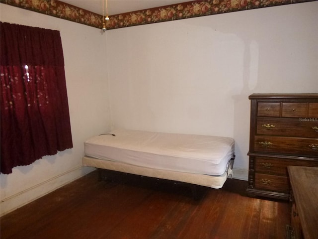 302 S Palm Ave, Frostproof, FL 33843 - bedroom with wood finished floors and baseboards