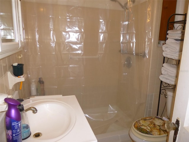 302 S Palm Ave, Frostproof, FL 33843 - bathroom featuring a shower stall, vanity, and tile walls