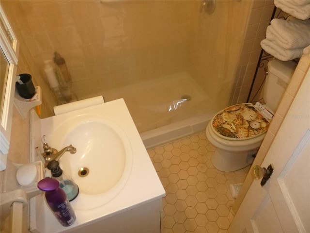 302 S Palm Ave, Frostproof, FL 33843 - full bathroom with toilet, vanity, walk in shower, and tile patterned flooring