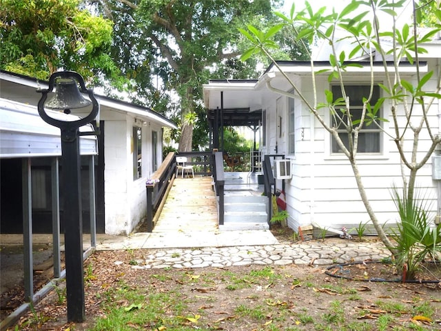 302 S Palm Ave, Frostproof, FL 33843 - view of property exterior with a wooden deck