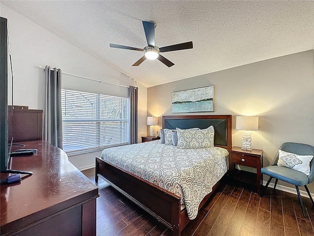 2696 Hemingway Ave, Haines City, FL 33844 - bedroom featuring lofted ceiling, a textured ceiling, dark wood-style flooring, and ceiling fan