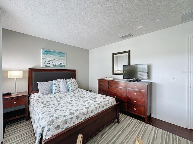 2696 Hemingway Ave, Haines City, FL 33844 - bedroom with a textured ceiling and light wood-type flooring