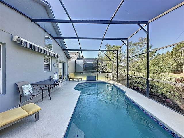 2696 Hemingway Ave, Haines City, FL 33844 - outdoor pool with a patio area and glass enclosure