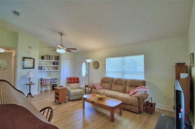 10 Armbruster Ct, Frostproof, FL 33843 - living area featuring a ceiling fan, light wood finished floors, and lofted ceiling