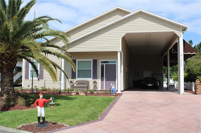 view of front of house with a front yard and a carport