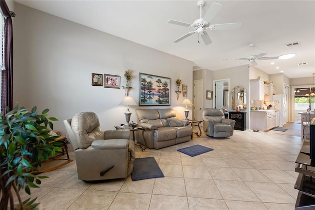 living room with light tile floors and ceiling fan