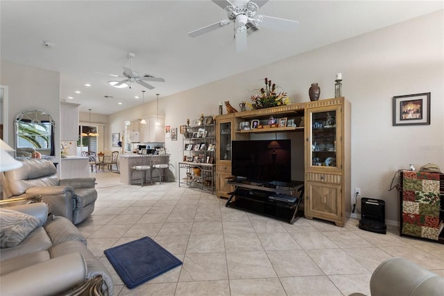 living room with light tile floors and ceiling fan