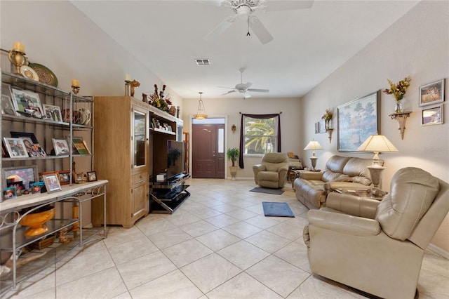 living room featuring ceiling fan and light tile floors