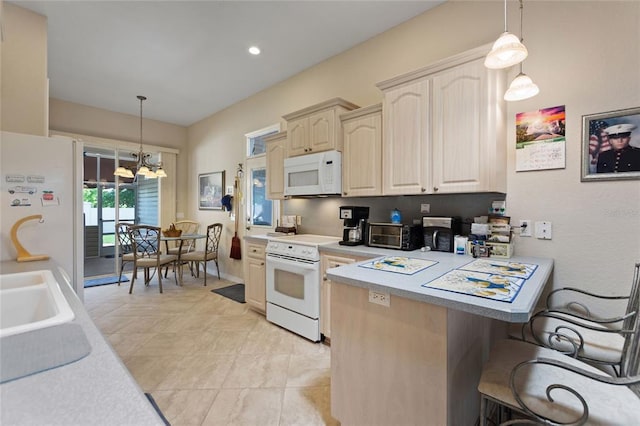 kitchen featuring light tile floors, white appliances, pendant lighting, and a chandelier