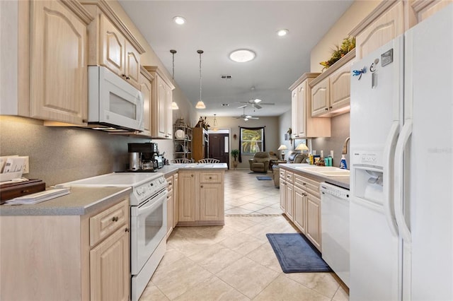 kitchen featuring ceiling fan, light brown cabinetry, white appliances, and kitchen peninsula