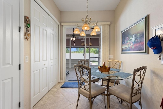 tiled dining space with a notable chandelier