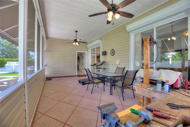 sunroom with ceiling fan and a wealth of natural light