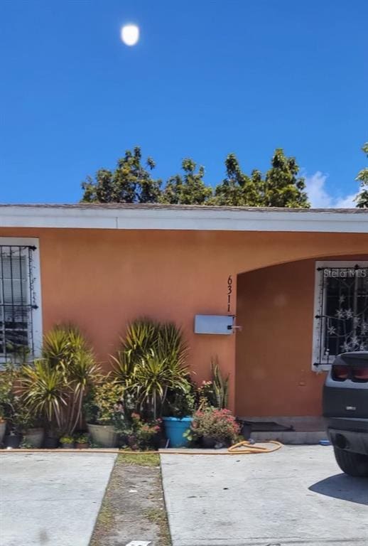 doorway to property featuring a patio