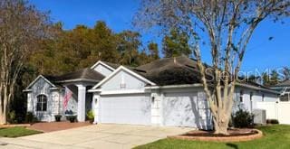 single story home with a garage