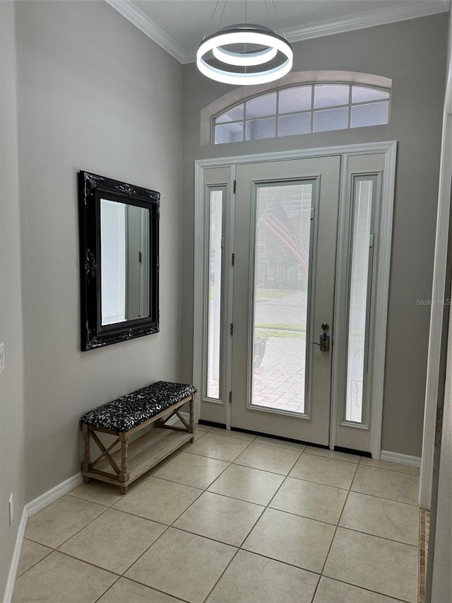 tiled entrance foyer with ornamental molding