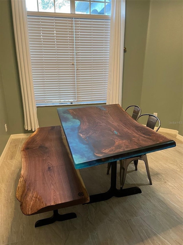 dining room with wood-type flooring