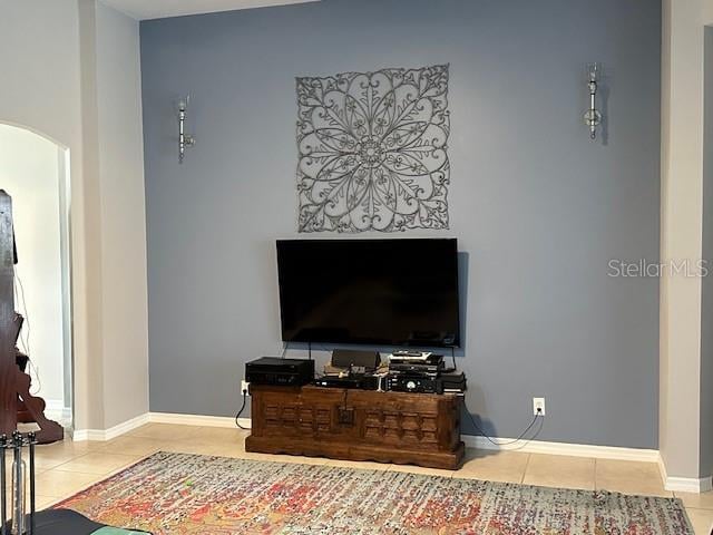 living room featuring light tile floors