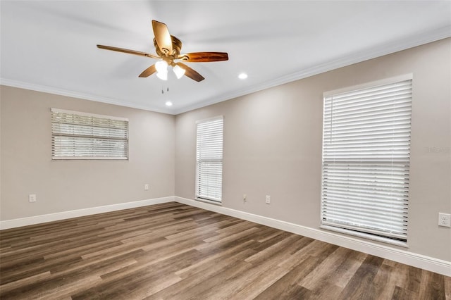 unfurnished room with ceiling fan, dark hardwood / wood-style flooring, and ornamental molding