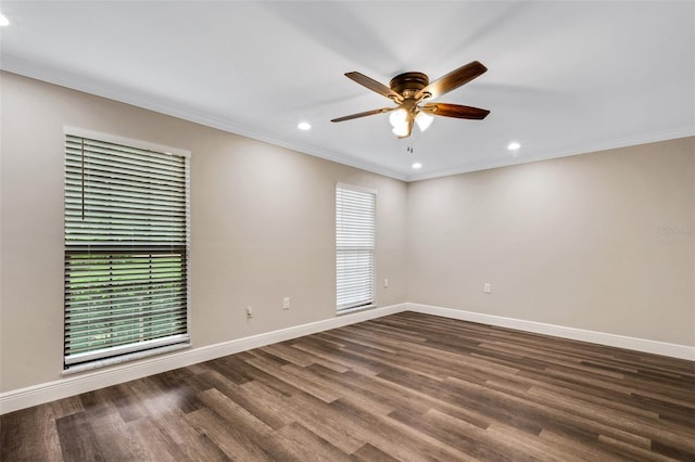 spare room with dark wood-type flooring, ceiling fan, and crown molding