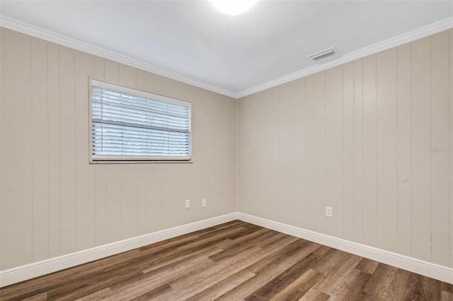 unfurnished room with crown molding and dark hardwood / wood-style floors