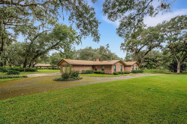 ranch-style house with a front yard