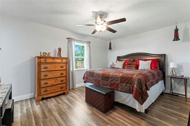 3016 Reiter Dr, Auburndale, FL 33823 - bedroom with wood-type flooring, ceiling fan, and a textured ceiling