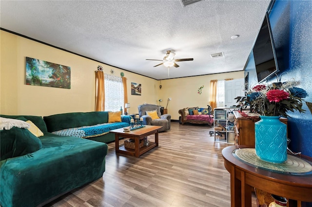 3016 Reiter Dr, Auburndale, FL 33823 - living room with hardwood / wood-style floors, ceiling fan, and a textured ceiling
