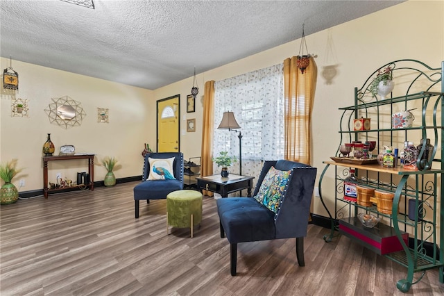 3016 Reiter Dr, Auburndale, FL 33823 - sitting room featuring dark hardwood / wood-style flooring and a textured ceiling