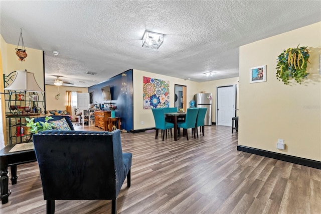 3016 Reiter Dr, Auburndale, FL 33823 - living room with wood-type flooring, ceiling fan, and a textured ceiling