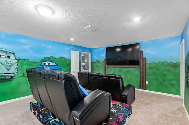 home theater room with light carpet and a textured ceiling