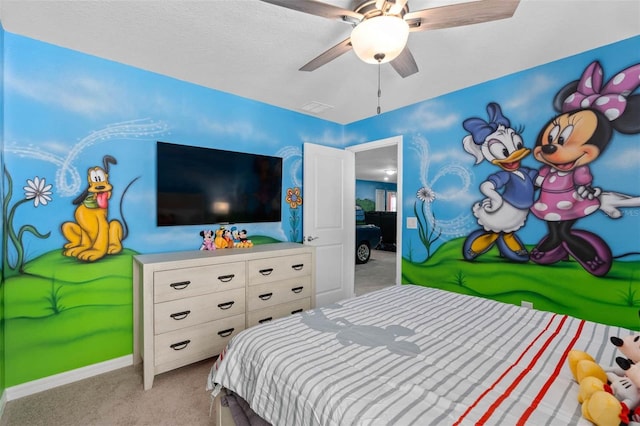 bedroom with ceiling fan and light carpet