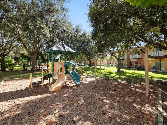 communal playground featuring a yard