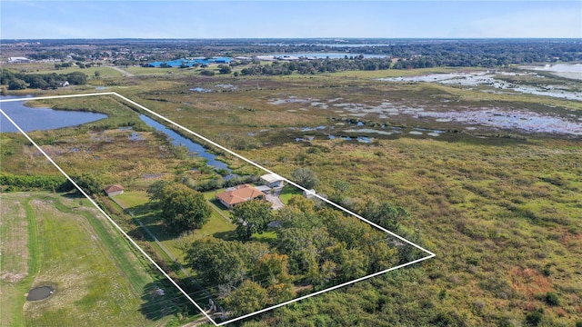 aerial view featuring a rural view and a water view