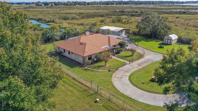 drone / aerial view featuring a rural view and a water view