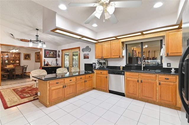 kitchen featuring dishwasher, sink, hanging light fixtures, kitchen peninsula, and light tile patterned flooring