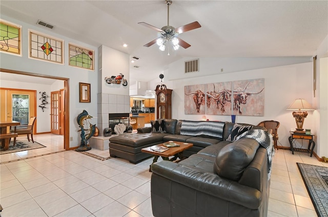 living room featuring light tile patterned floors, high vaulted ceiling, and ceiling fan