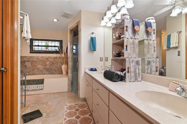 bathroom featuring plus walk in shower, vanity, and ceiling fan