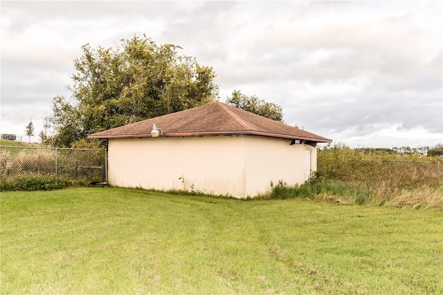 view of side of home featuring a lawn