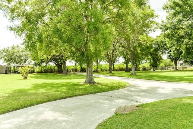 view of property's community featuring a yard