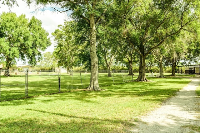 view of property's community featuring a yard