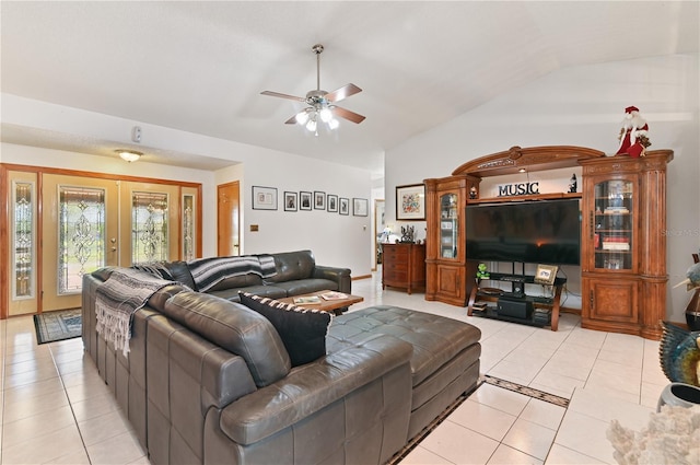 tiled living room with french doors, vaulted ceiling, and ceiling fan