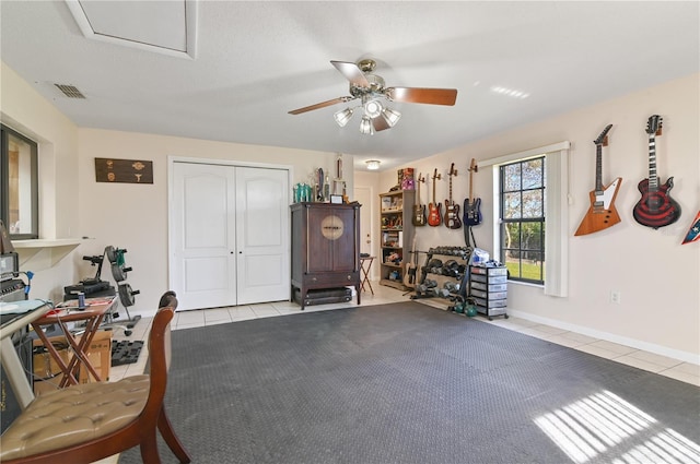 misc room featuring ceiling fan and light tile patterned floors