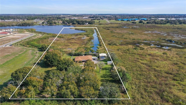 drone / aerial view with a water view and a rural view