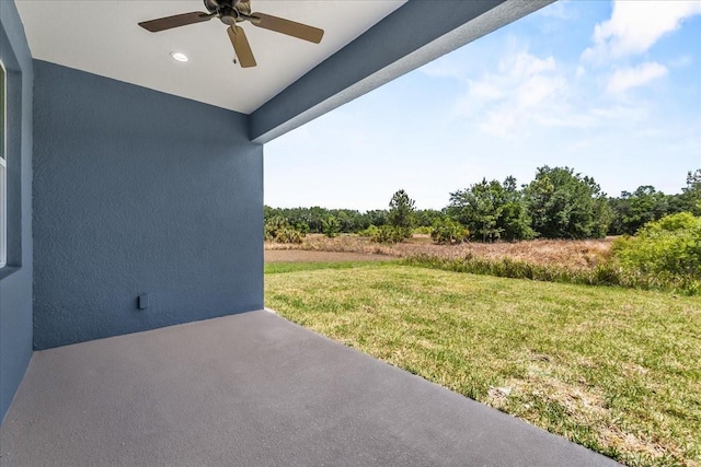 view of yard with a ceiling fan and a patio area