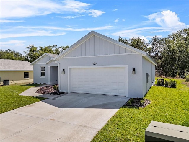 view of front of home with cooling unit, a front yard, a garage, and board and batten siding