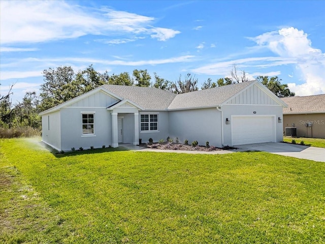 ranch-style house featuring a front lawn, driveway, a garage, and board and batten siding