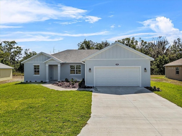 single story home featuring a garage, board and batten siding, a front lawn, and driveway