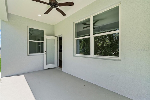 exterior space with a ceiling fan