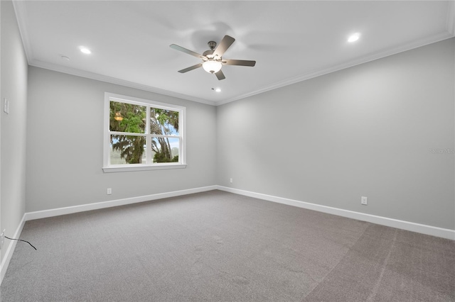 unfurnished room featuring baseboards, dark carpet, and a ceiling fan